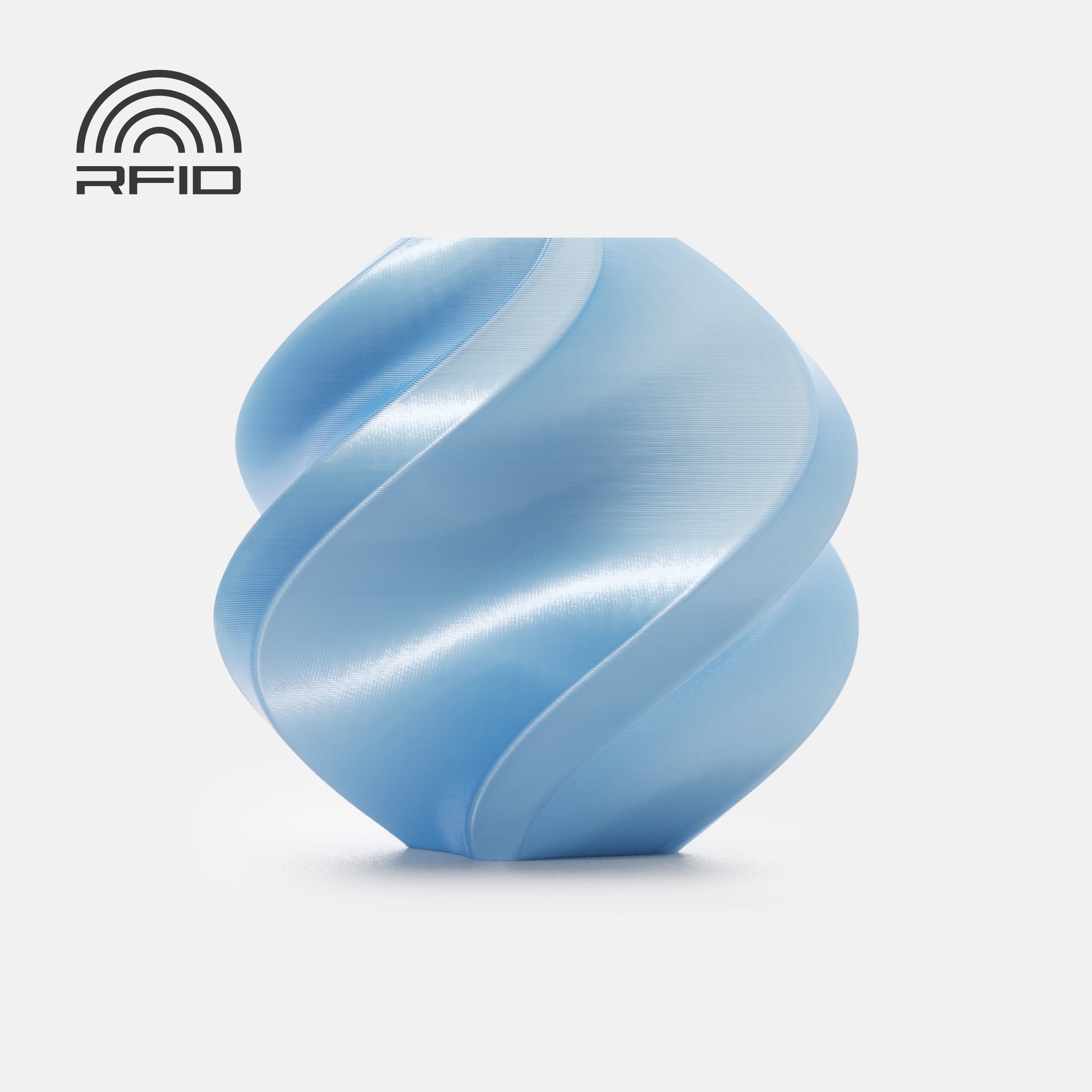 A light blue, spiral-shaped geometric object—3D printed with BambuLab PLA Silk+ from 3D Printing Perth - Cirrus Link—rests on a white background, featuring an RFID symbol in the top left corner.