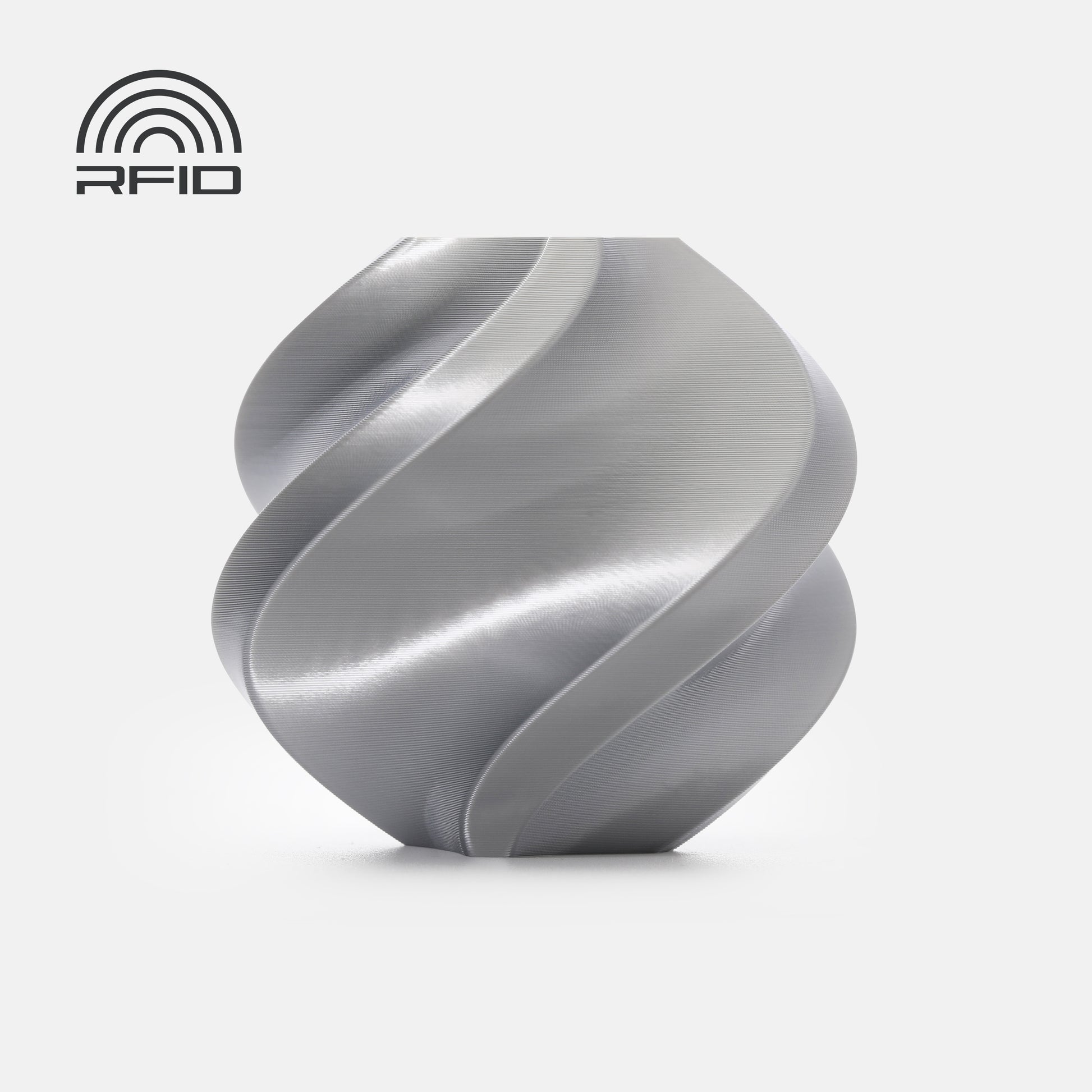 A metallic spiral object made from BambuLab PLA Silk+ by 3D Printing Perth - Cirrus Link rests on a white background, with an RFID symbol in the top left corner.