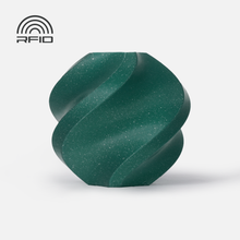 A dark green, faceted, spiral-shaped object made from Bambu Lab Filament - PLA Sparkle by 3D Printing Perth - Cirrus Link sits on a white background. A matte texture, high impact strength, and an RFID symbol are also visible.