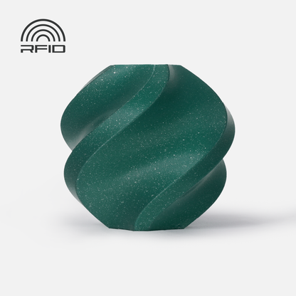 A dark green, faceted, spiral-shaped object made from Bambu Lab Filament - PLA Sparkle by 3D Printing Perth - Cirrus Link sits on a white background. A matte texture, high impact strength, and an RFID symbol are also visible.
