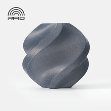A matte, speckled dark gray vase made with Bambu Lab Filament - PLA Sparkle from 3D Printing Perth - Cirrus Link stands on a white background. An RFID icon appears at the top left.