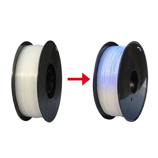 Two spools of 3D filament are shown side by side with a red arrow between them; the left spool is white, and the right spool is Toyar PLA (UV Light Colour Change) 1.75mm filament in light blue.