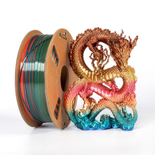 A spool of Toyar PLA Silk Rainbow 1.75mm 3D Printing Filament stands beside a vibrant, rainbow-colored PLA dragon sculpture on a white background.