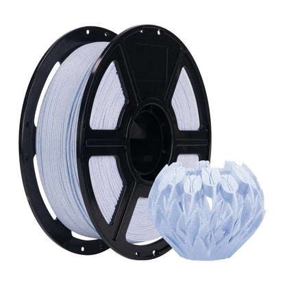 A spool of Flashforge HS PLA 1.75mm 3D Printing Filament in Marble Colour sits beside a textured, leaf-patterned vase, highlighting the brand's reliable extrusion and smooth surface finish.