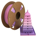 A spool of Toyar PLA Matte Rainbow 1.75mm Filament sits beside a 3D-printed multi-story pagoda, showcasing Toyar’s smooth matte gradient from pink to purple.