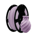 A spool of Flashforge PLA Matte Colour 1.75mm 3D Printing Filament in light purple sits beside a matching, spiral-patterned vase—perfect for achieving precise, smooth prints.