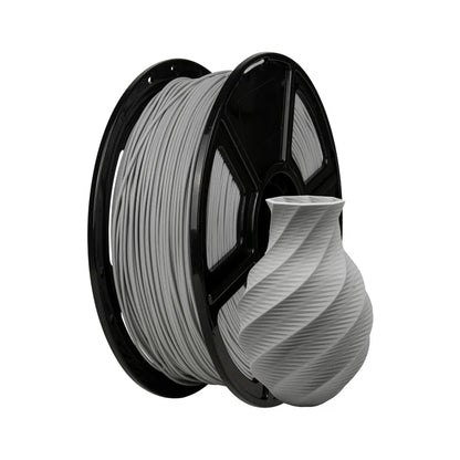 A spool of Flashforge PLA Matte 1.75mm 3D Printing Filament in gray is displayed beside a small, twisted-design vase 3D-printed in matching matte gray.