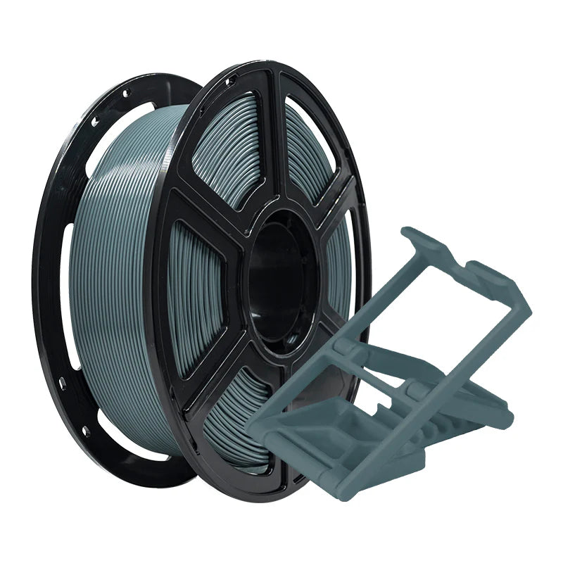 A spool of Flashforge PLA Pro 1.75mm 3D Printing Filament in gray is displayed next to a small, geometric 3D-printed plastic object.