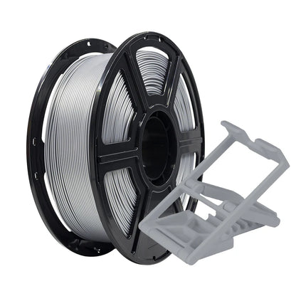 A spool of Flashforge PLA Pro 1.75mm Basic Colour filament sits beside a small gray 3D print, demonstrating the precision and quality achievable with Flashforge’s high-performance 3D printing filament.