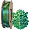A spool of Toyar PLA Silk Rainbow Colours Alternating 1.75mm filament sits next to a decorative 3D creation, showcasing intricate patterns in blue, green, and yellow hues.