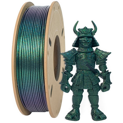 A spool of Toyar PLA Magic Color 1.75mm Filament (Sparkling) in iridescent green sits beside a samurai figurine crafted from the same captivating 3D printing material.