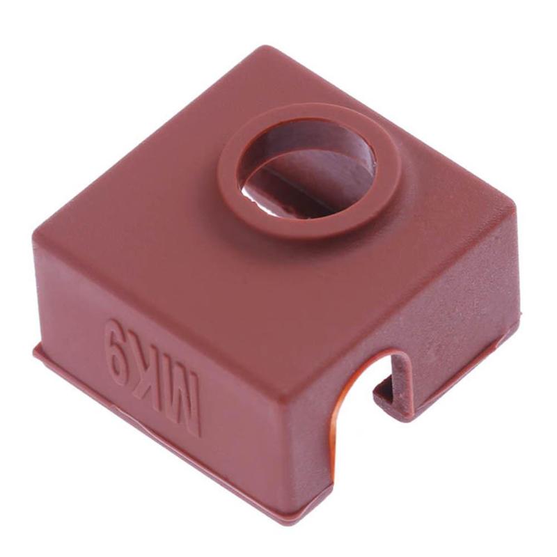 The MK9 Hotend Silicone Case Cover by 3D Printing Perth - Cirrus Link is a brown plastic square cover with a circular hole on top and a small notch on the side, known for its excellent thermal insulation and high-temperature resistance.