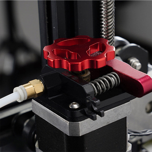 Close-up of a 3D printer extruder with a red adjustment knob, durable metal parts, and spring for smooth functionality: Motor Manual Nut for E-axis Extruder by 3D Printing Perth - Cirrus Link.