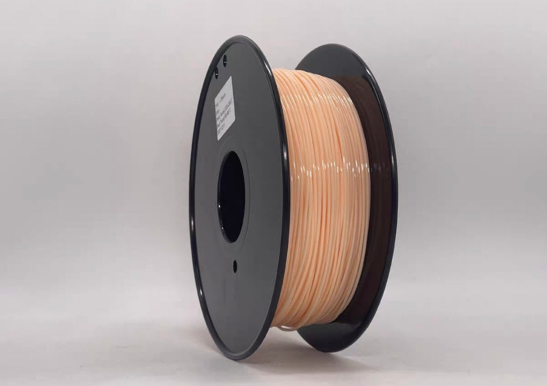 A spool of Toyar TPU Standard Colour 1.75mm 3D Printing Filament in light peach, with black plastic flanges, stands upright against a plain white background—ideal for flexible 3D printing projects.