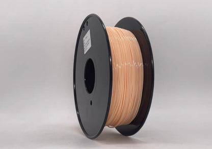 A spool of Toyar TPU Standard Colour 1.75mm 3D Printing Filament in light peach, with black plastic flanges, stands upright against a plain white background—ideal for flexible 3D printing projects.