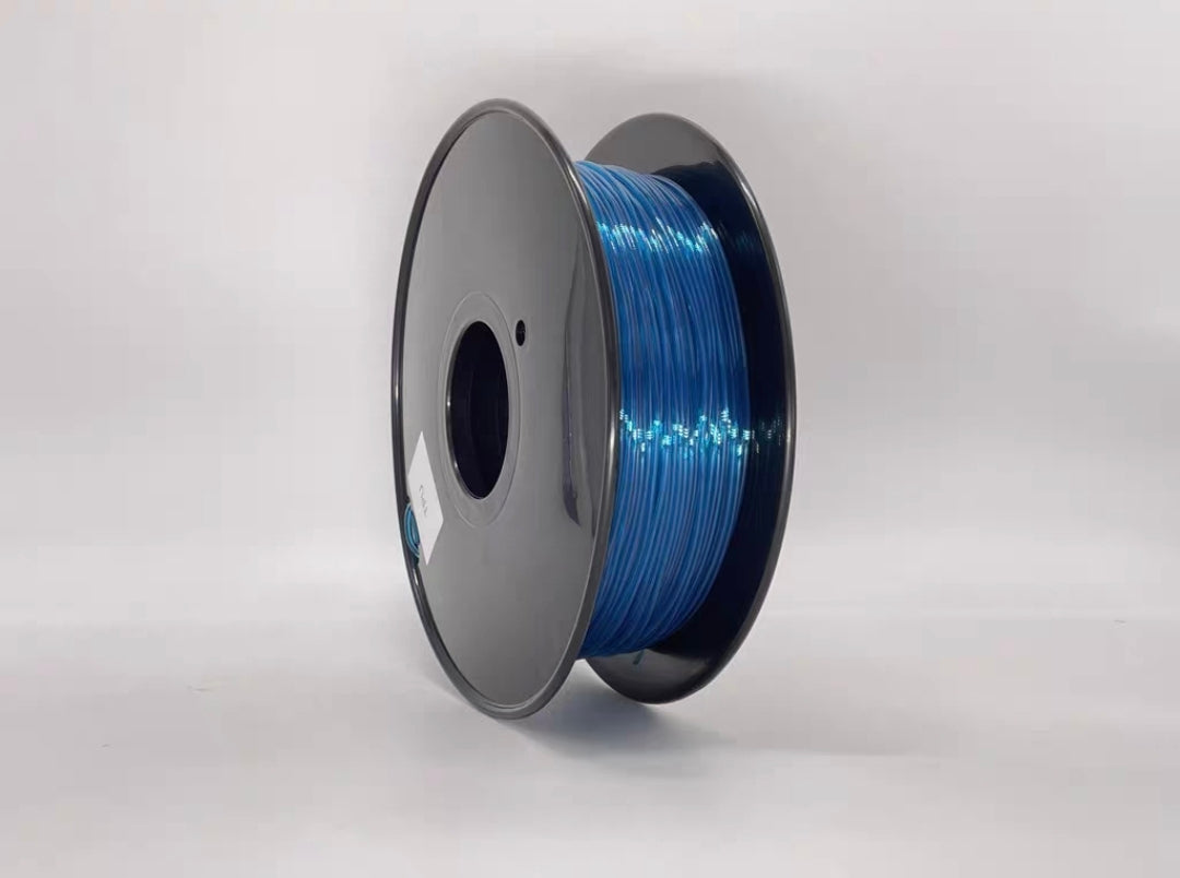 A spool of Toyar TPU Transparent 1.75mm 3D Printing Filament is wound on a gray plastic reel, displayed against a plain white background.