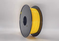 A spool of Toyar TPU Standard Colour 1.75mm yellow filament for 3D printing, neatly wound on a black plastic reel, is displayed against a plain background.