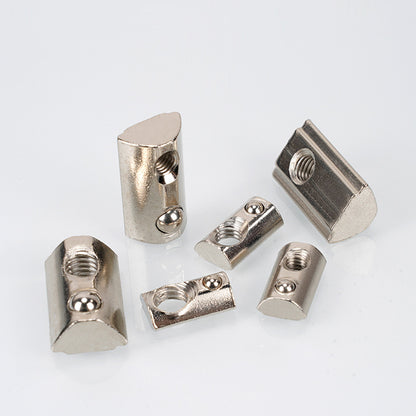 Six Aluminium Profile Elastic Ball Nut Type 20 units from 3D Printing Perth - Cirrus Link, displayed on a white background. They vary in size and design, featuring threaded holes and smooth finishes. Perfect for integrating into linear motion systems or efficiently securing aluminium profiles.