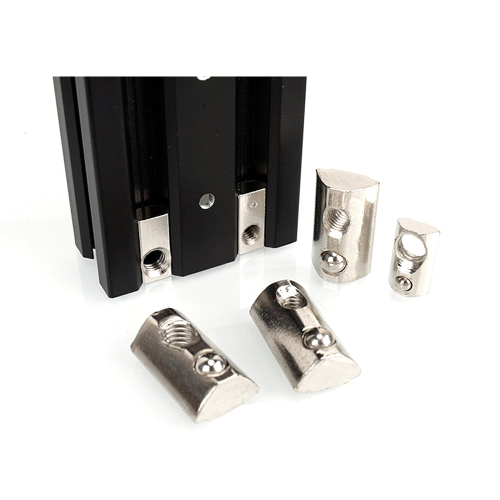 Close-up of five Aluminium Profile Elastic Ball Nut Type 20 pieces from 3D Printing Perth - Cirrus Link with a black aluminum extrusion profile, essential components for Linear Motion Systems, on a white background.