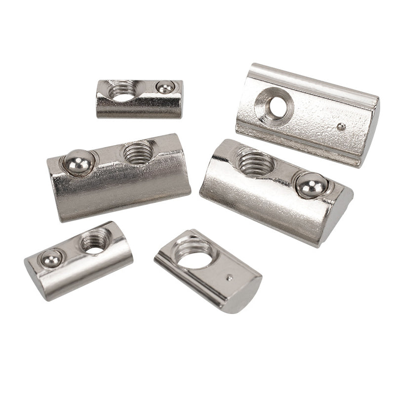 A collection of components essential for Linear Motion Systems is arranged in a group, featuring the Aluminium Profile Elastic Ball Nut Type 20 by 3D Printing Perth - Cirrus Link, characterized by silver-colored metal fittings with threaded holes and smooth surfaces.
