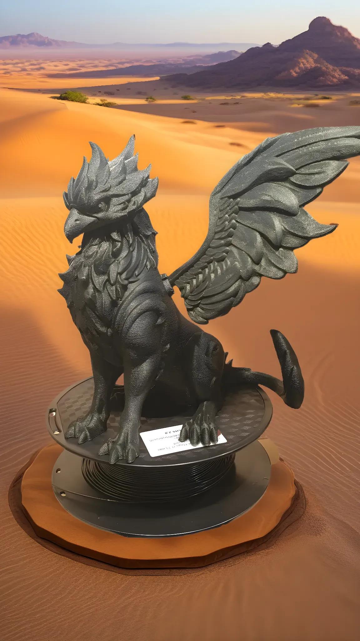 A black griffin statue with large wings, crafted from Hello3D PLA Magic Colour 1.75mm 3D Printing Filament, stands on a circular platform amidst a sandy desert with distant rocky hills.