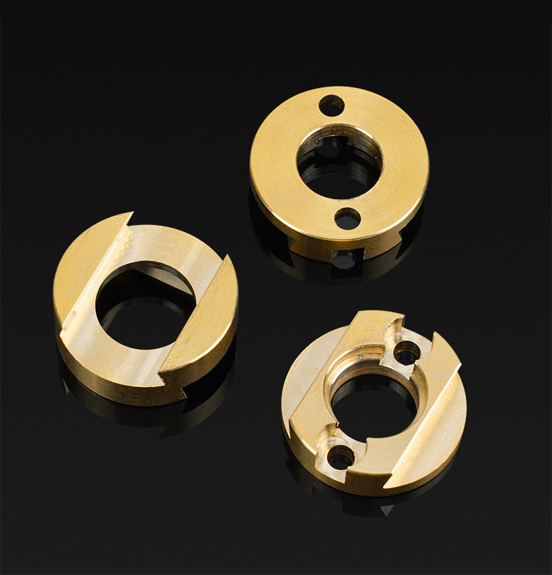 Three round, gold-colored Oldham Coupler and T8 Z-Axis Screw Upgrade components by 3D Printing Perth - Cirrus Link are shown on a black reflective surface, each with distinct cutouts and holes for Ender 3 BLV correction.