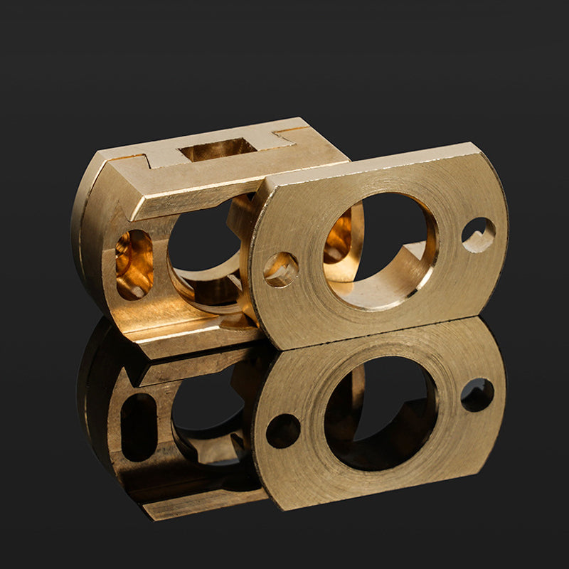 Two precision-machined brass components from 3D Printing Perth - Cirrus Link, designed for the Oldham Coupler T8 Z Axis Screw Upgrade on BLV Ender 3 Creality Machines, are shown on a reflective black surface.