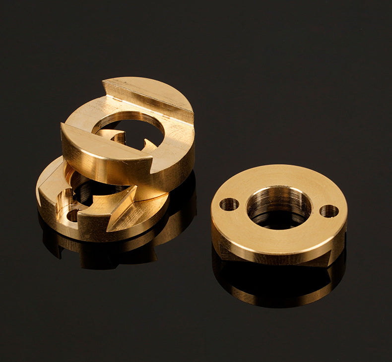Four circular brass Oldham Coupler and T8 Z-Axis Screw Upgrade components for Ender 3 BLV Correction by 3D Printing Perth - Cirrus Link, each with two holes, are displayed on a glossy black surface.