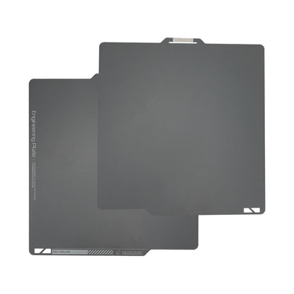 Two overlapping dark gray engineering plates with rounded corners are made from magnetic steel film, featuring a smooth surface and a top tab, designed specifically for the Bambu Lab X1 Magnetic Steel 268*258mm Print Surface by 3D Printing Perth - Cirrus Link.