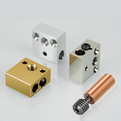 The image features four metal components: two CNC CR10/Ender 3 heat blocks in silver, one in gold, and a copper rod with a threaded end from the brand 3D Printing Perth - Cirrus Link, all set against a light gray background.