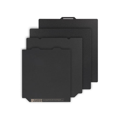 Four black swatches of the Polyurea Hot Bed Platform, each differing in size, are stacked and fanned out against a white background, showcasing the precision associated with 3D Printing Perth - Cirrus Link's products for materials like PLA, PETG, and ABS.