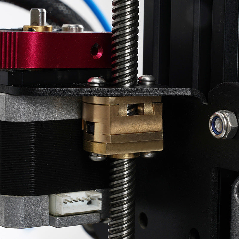 Close-up of a 3D printer’s Z-axis with brass lead screw nut, threaded rod, stepper motor, and metal frame—perfect for installing the 3D Printing Perth - Cirrus Link Oldham Coupler T8 Z Axis Screw Upgrade for BLV Ender 3 Creality Machines.
