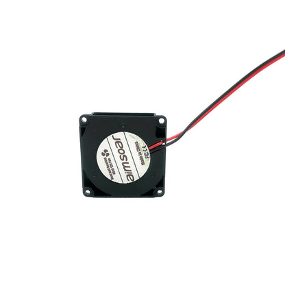 The Turbo Fan 4010 12V from 3D Printing Perth - Cirrus Link is a square black cooling fan with dual ball bearings and red and black wires. It features a central label with text and is perfect for efficient 3D printing cooling.