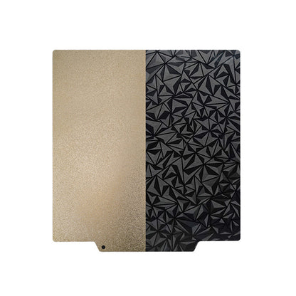 Introducing the PEI PEO Dual-Sided 3D Printer Build Surface by 3D Printing Perth - Cirrus Link: a square sheet divided vertically into a fine-textured gold half and a geometric-patterned black half. This dual-sided hot bed platform is designed to ensure excellent adhesion and effortless print removal, enhancing the precision of your 3D printing creations.