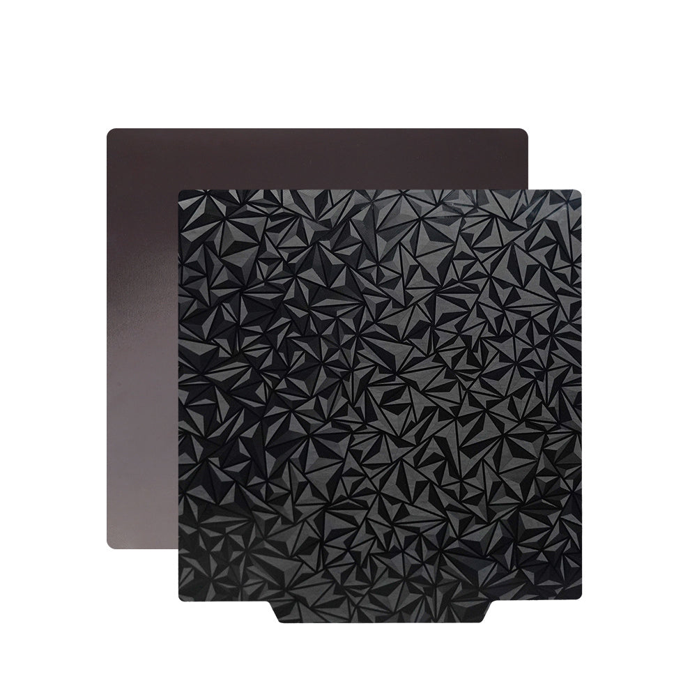 Two dark-colored sheets from the 3D Printing Perth - Cirrus Link brand: one featuring a smooth finish and the other showcasing a geometric, triangular pattern. These PEI PEO Dual-Sided 3D Printer Build Surfaces are crafted for optimal adhesion and easy print removal on any PEI/PEO hot bed platform.