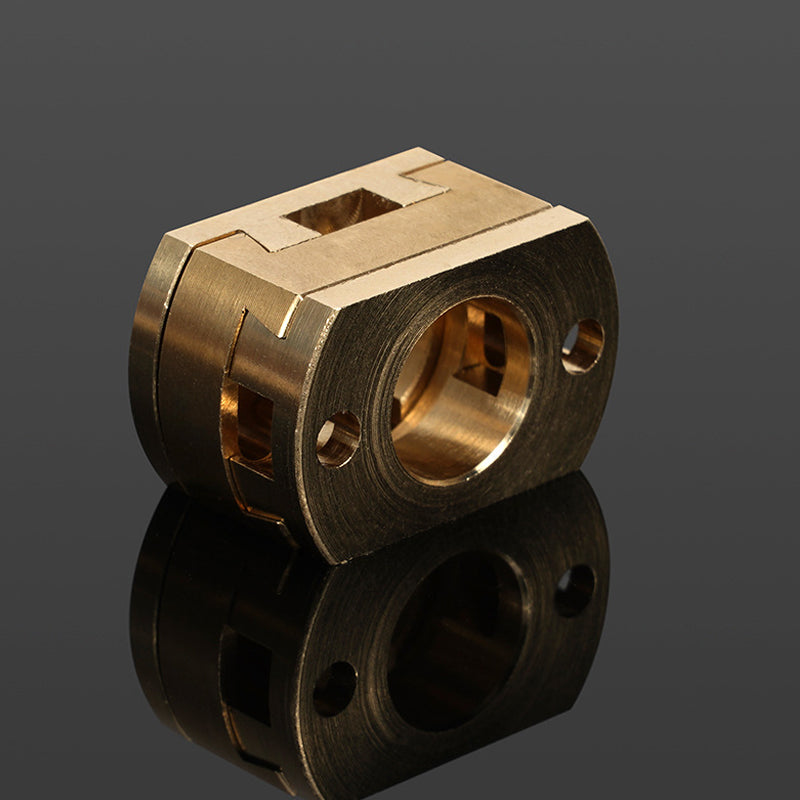 The Oldham Coupler T8 Z Axis Screw Upgrade by 3D Printing Perth - Cirrus Link, designed for BLV Ender 3 Creality Machines, features a machined brass body with a central circular opening and two side holes, ideal for 3D printer upgrades.